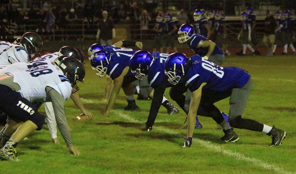 South Whidbeys defensive front gets ready to explode on the snap.(Photo by Jim Waller/South Whidbey Record)