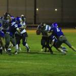 Dexter Jokinen (6) helps bring down a Sultan runner as Alex Black (11) and Tasman Dussault (44) close in.(Photo by Jim Waller/South Whidbey Record)