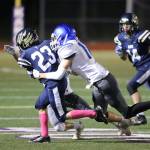 The Falcons Aidyn Frederick brings down Cedar Park Christians Isaac Ferguson.(Photo by John Fisken)