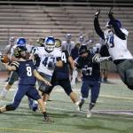 South Whidbeys Jakob Snelling (79) leaps in an attempt to stop a throw by Cedar Park Christian quarterback Daniel Rickman. (Photo by John Fisken)