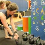 Becca Swan participates in an adult kettlebells class at The Backyard in Langley. Photo by Wendy Leigh / South Whidbey Record