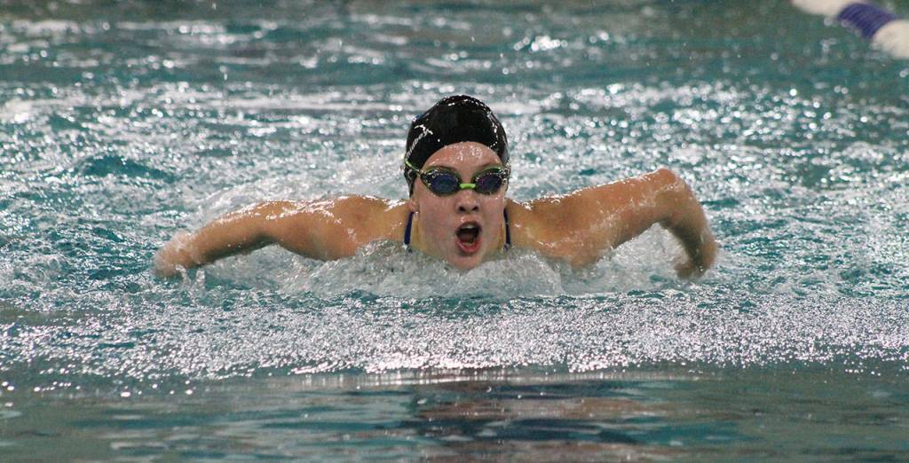 Parker Forsyth swims to fifth place in the 100-yard butterfly. (Photo by Jim Waller/South Whidbey Record)