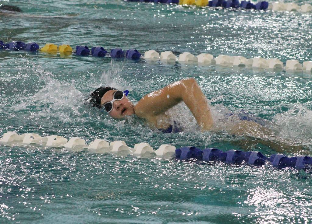 Devin King swims in the 100 freestyle at Snohomish.(Photo by Jim Waller/South Whidbey Record)