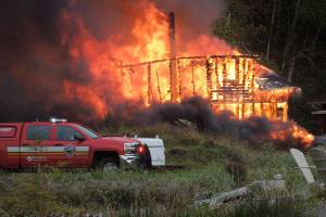 Man injured in house fire dies