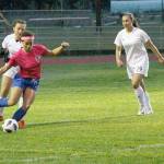 Simone White manuevers for a shot for South Whidbey.(Photo by Jim Waller/South Whidbey Record)