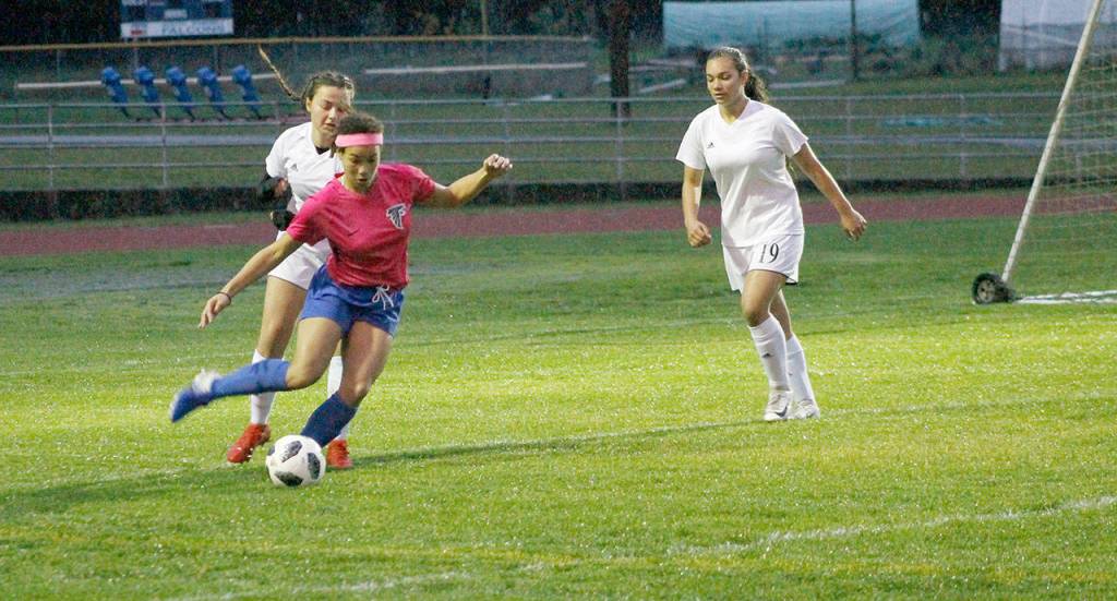 Simone White manuevers for a shot for South Whidbey.(Photo by Jim Waller/South Whidbey Record)