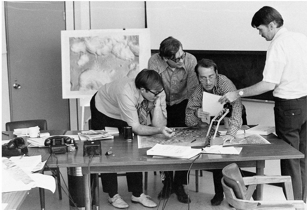 Grant Heiken, at far right, and other scientists discuss ideas at a NASA lab. Photo courtesy of Grant Heiken
