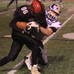 Bodie Hezel brings down Mount Bakers Waylon Kentner.(Photo by Jim Waller/South Whidbey Record)