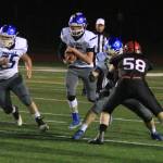 South Whidbeys Kobe Balora (75) leads Kole Nelson through a gap in the Mount Baker defense.(Photo by Jim Waller/South Whidbey Record)