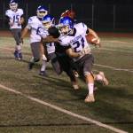 Billy Rankins scoots around end for the Falcons.(Photo by Jim Waller/South Whidbey Record)