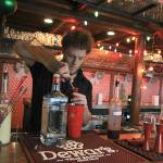 Photo by Laura Guido/Whidbey News Group                                Captain Whidbey Inn bartender Aaron Bloom mixes a specialty cocktail as part of the Christmas pop-up Miracle. As part of the inns holiday-themed events, community members are invited to help decorate the tree in the lobby, a revival of an old tradition.