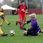 Photo courtesy of Linfield Athletics                                South Whidbey High School graduate Julian Inches records a save for the Linfield College soccer team this fall.