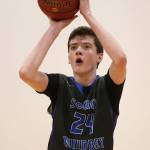 Sterling Patton scores for South Whidbey in Fridays win over Oak Harbor. Patton pumped in 34 points for the Falcons. (Photo by John Fisken)
