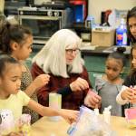 Photo by Kira Erickson / South Whidbey Record                                Bonnie Arndt demonstrates how to attach a handle to a completed lantern at Create Space on Dec. 11.