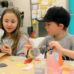 Photo by Kira Erickson / South Whidbey Record                                Cousins Kailea Bravo and Kamdin Hill make lanterns for the parade.