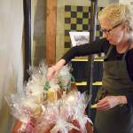 Photos by Patricia Guthrie                                Whidbey WaxWorks artisan and owner Prescilla Lowry sorts through her handmade candles.