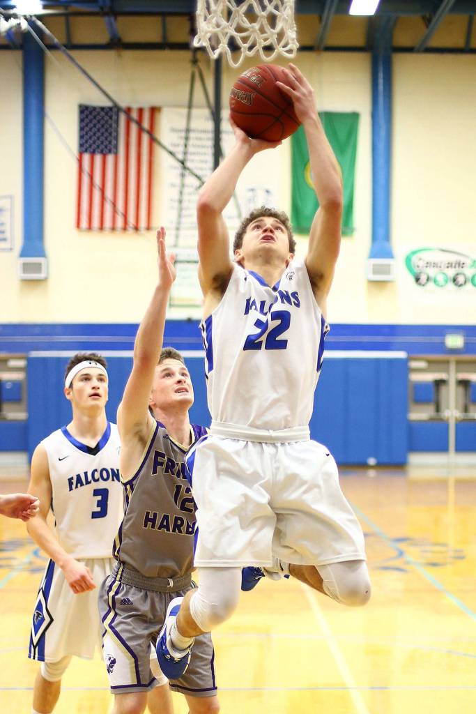 Luke Rookstool (22) heads to the hoop.(Photo by John Fisken)