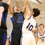 Levi Buck (25) powers to the hoop.(Photo by John Fisken)