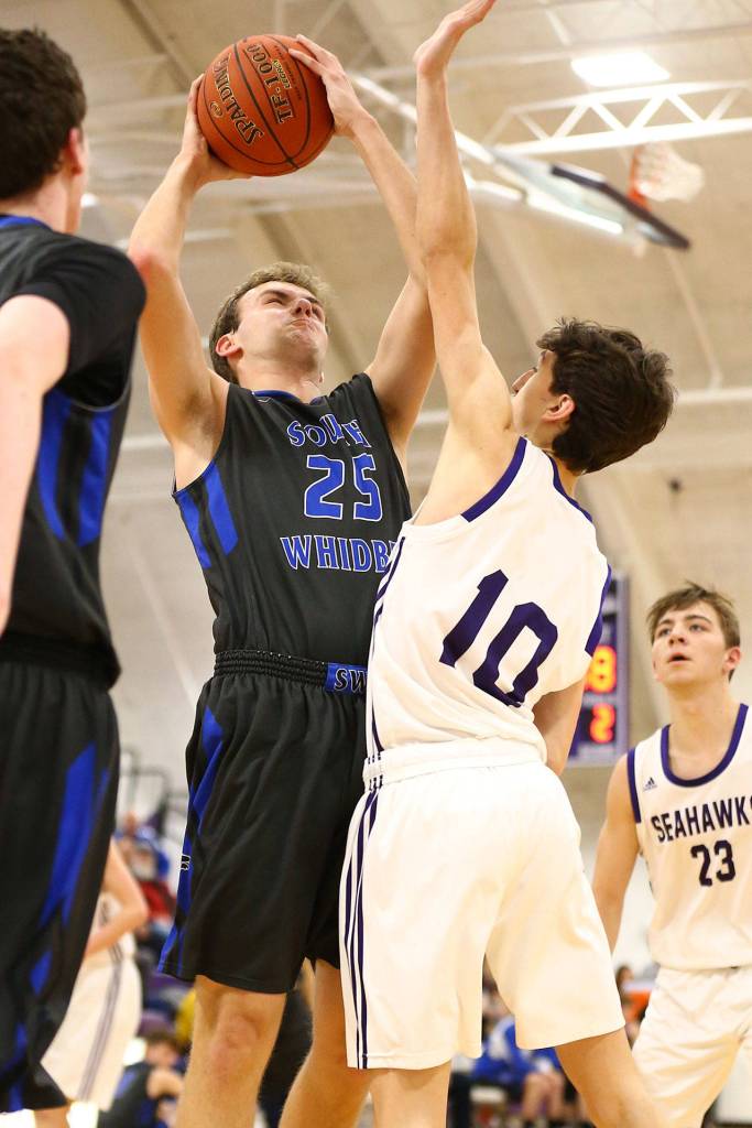 Levi Buck (25) powers to the hoop.(Photo by John Fisken)