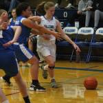Liz Haines clears some space as she attacks the baseline.(Photo by Jim Waller/South Whidbey Record)