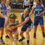 Emma Hodson secures the ball for the Falcons.(Photo by Jim Waller/South Whidbey Record)
