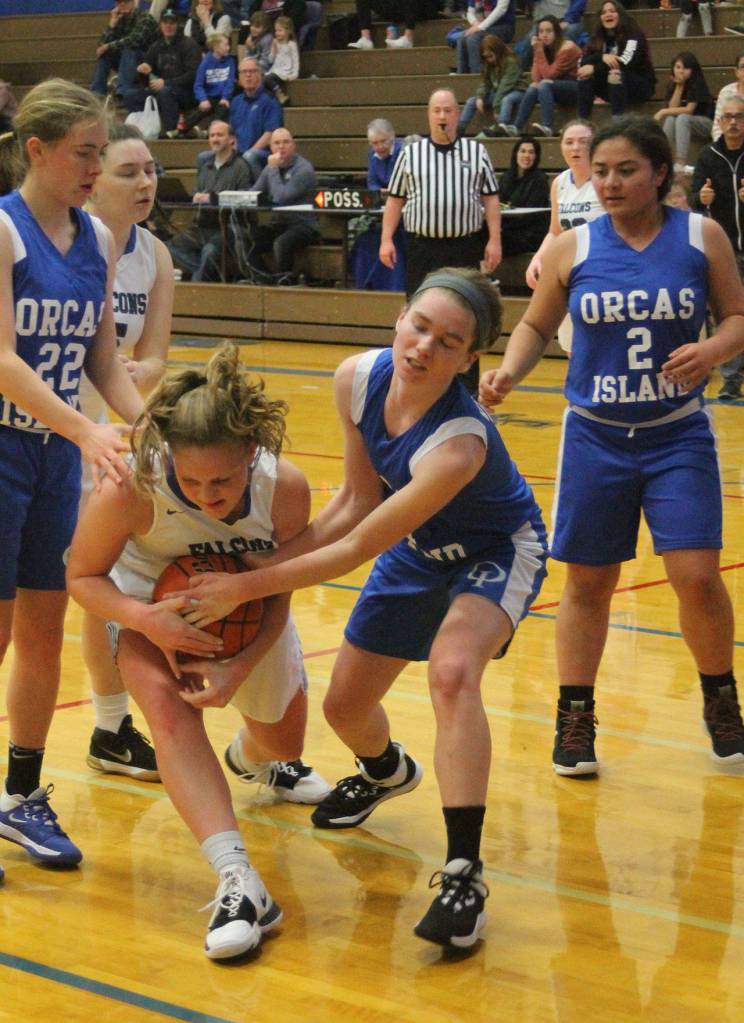 Emma Hodson secures the ball for the Falcons.(Photo by Jim Waller/South Whidbey Record)