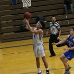 Jacob Ng finishes off a fast break.(Photo by Jim Waller/South Whidbey Record)