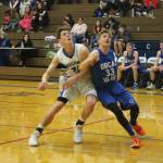 South Whidbeys Carson Wrightson fights Orcas Islands August Groeninger (33) for rebounding position.(Photo by Jim Waller/South Whidbey Record)