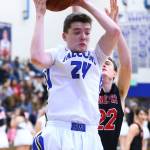 Sterling Patton muscles a rebound in front of Coupevilles Gavin Knoblich (22).(Photo by John Fisken)