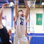 Carson Wrightson powers to the hoop for 2 points.(Photo by John Fisken)