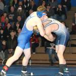 Kaidyn Brinks, left, tangles with Sultans Dylan Konicki.(Photo by Jim Waller/South Whidbey Record)