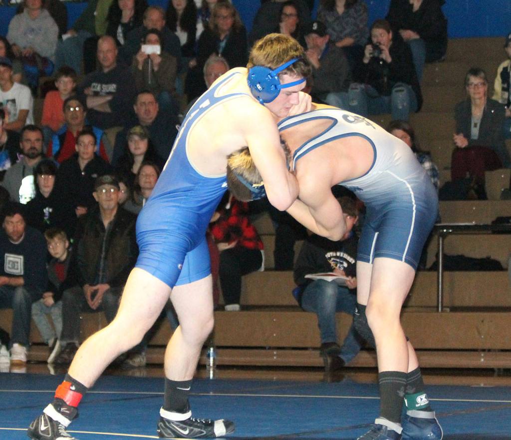 Kaidyn Brinks, left, tangles with Sultans Dylan Konicki.(Photo by Jim Waller/South Whidbey Record)