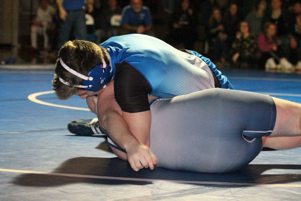 Aiden Coleman, top, turns the Turks Mike Moss.(Photo by Jim Waller/South Whidbey Record)