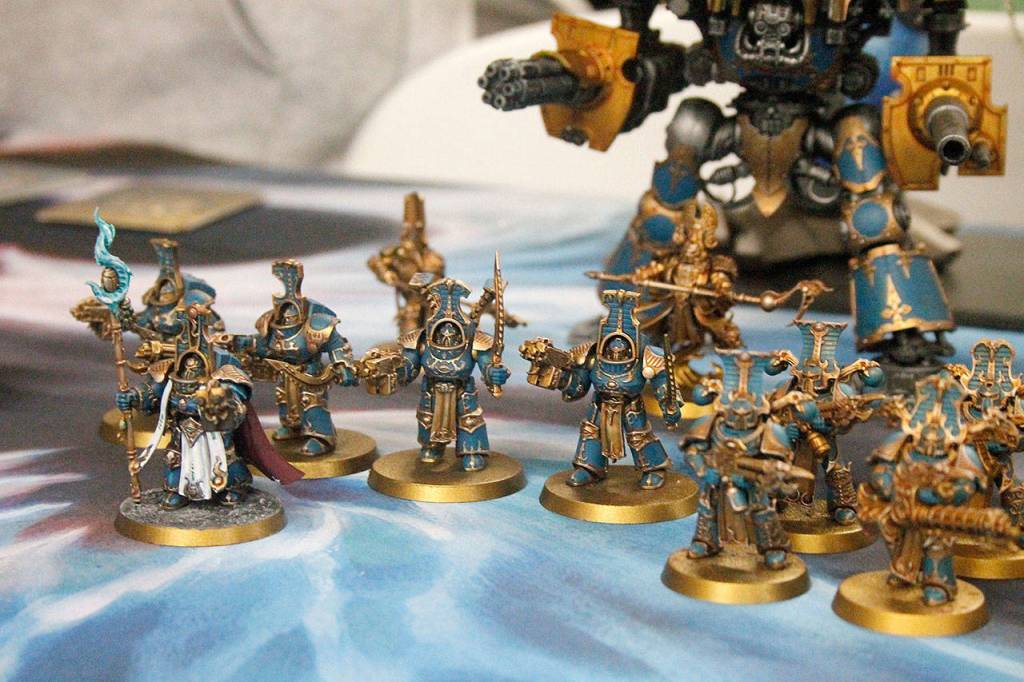 A row of expertly hand-painted miniature models used in a typical game of Warhammer, painted by Jacob Bloom, can be found at Jesters Keep.