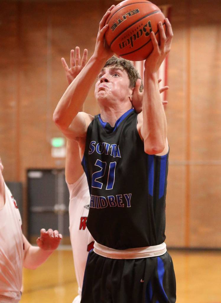 Carson Wrightson is fouled on the way to the rim.(Photo by John Fisken)