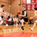 South Whidbeys Nick Young attacks the key in the Falcons win over Coupeville Tuesday. (Photo by John Fisken)
