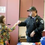 Third grader Arianna Boden shares a fist bump with Police Chief Don Lauer.