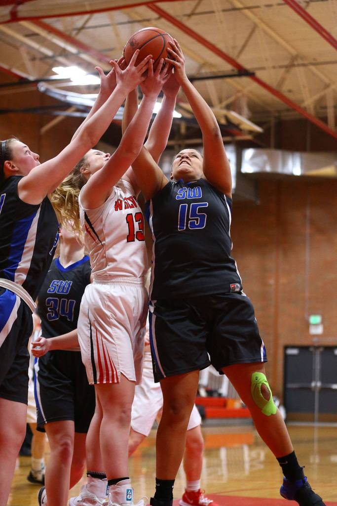 Arianna Briggs, right, battles for a rebound.(Photo by John Fisken)