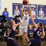 Kole Nelson soars above the Nooksack Valley defense for a shot. (Photo by Steve Smith)