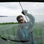 Photo by Kira Erickson/Whidbey News Group                                Business owner Oliver Hansen cleans a window at a Mutiny Bay residence on Monday.