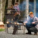 Photo provided                                Chef JP Dowdell, right, and firemaster Baron Molo cook food on a fire table of Dowdells creation.