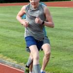Luc Gandarias heads up the back stretch in the 1,600 meters. (Photo by Jim Waller/South Whidbey Record)
