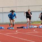 The Falcons shoot out of the blocks in the girls 100 meters. (Photo by Jim Waller/South Whidbey Record)