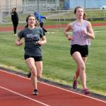 The 1,600 and 3,200 were run simultaneously Saturday. Grace Huffman, left, won the 1,600, and Kaia Swegler Richmond, right, captured the 3,200.(Photo by Jim Waller/South Whidbey Record)