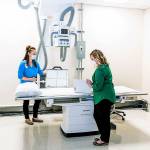 Photo provided                                Jenifer Toner, Supervisor and Jennifer Marcum, Manager of Diagnostic Services, take care of final preparations at Walk-In Clinic Clinton before its opening on Tuesday, June 2.