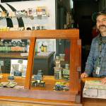 Photo by Kira Erickson/Whidbey News-Times                                Budtender Tyler Small arranges a display behind a window in Island Herb. The Freeland cannabis store experienced record-breaking sales in March.