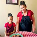 Photo provided                                Auntie Jackie Huerta often has her 8-year-old granddaughter, Naomi Jean, to help her in the kitchen.