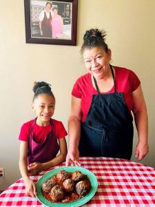 Photo provided                                Auntie Jackie Huerta often has her 8-year-old granddaughter, Naomi Jean, to help her in the kitchen.