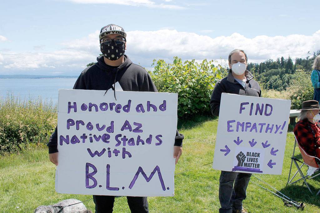 Photo by Kira Erickson/Whidbey News Group                                Visitor Tayven Lewis from Arizona joined the protest this week with his grandfather, Richard Draves.