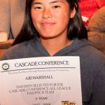 Ari Marshall holds up one of her all-conference certificates. (Photo by Paul Lien)